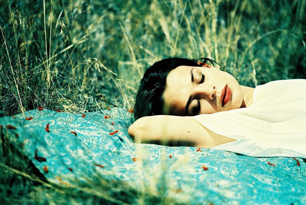 Editorial shooting for a girl sleeping in a field