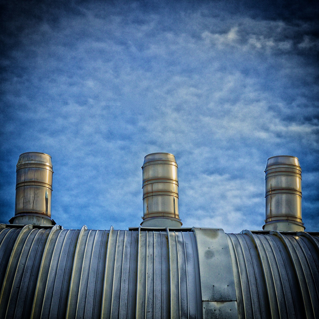 minimal photo of a factory roof and sky