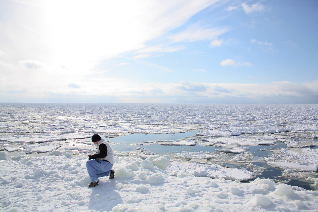 Photographer in ice flow